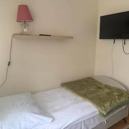 Quarto em Acomodações Particulares Flasinscy Goscinne